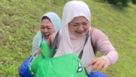 These 3 women ride a dinosaur balloon