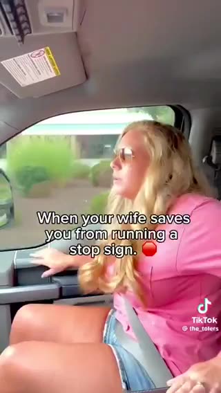 Wife saves him from running stop sign