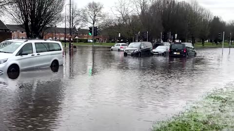 Cars abandoned after overnight rain floods roads in Manchester