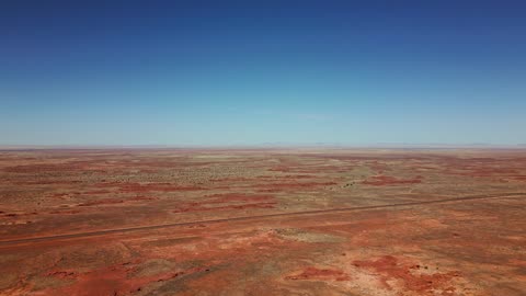 Mixkit Large Desert On a Sunny Day in an aerial view