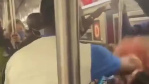 Black man beats white woman on train