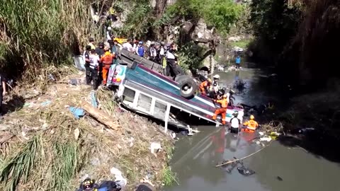 At least 50 dead after bus plunges off bridge in Guatemala