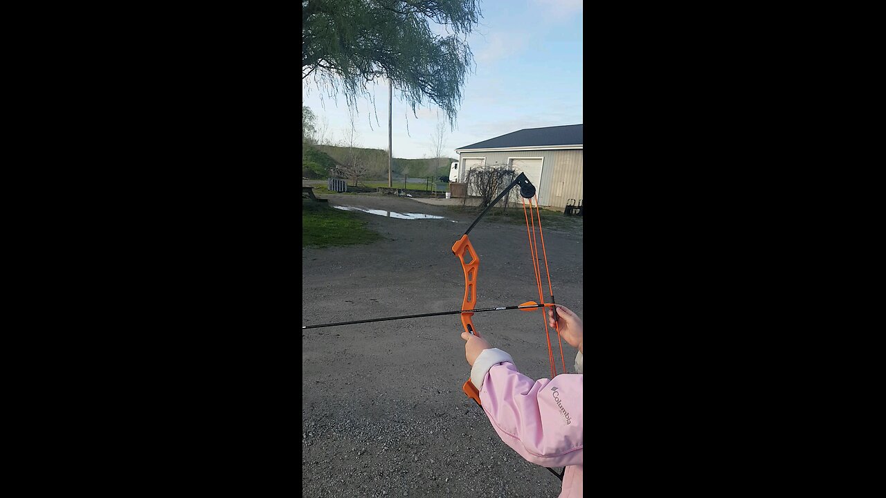 Target practice, kids testing new compound bow.