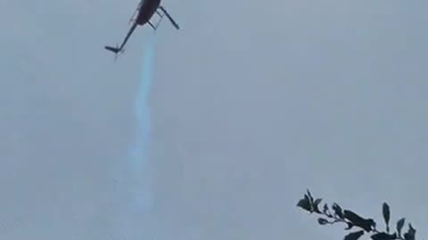 Helicopter sprays blue chemical over house in Florida