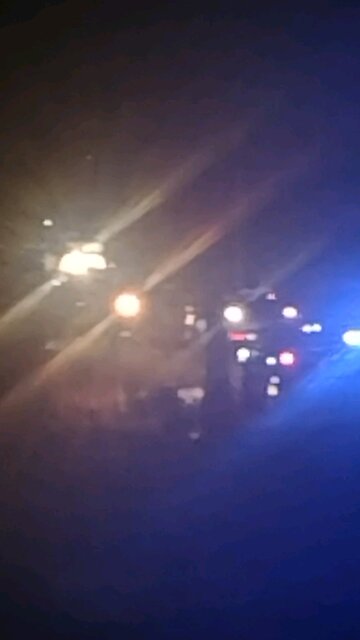 police, fire, and other first responders deal with downed tree and burning power pole