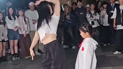 The street dance solo between two sisters is so beautiful.