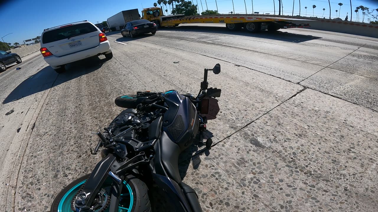 Lane Splitting Motorcyclist Hit By Sudden Merger