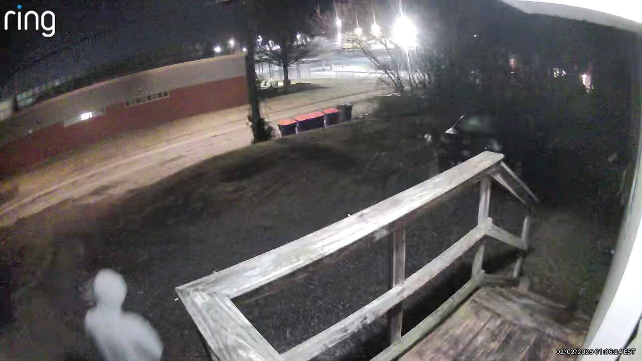 dumping something in trash can.