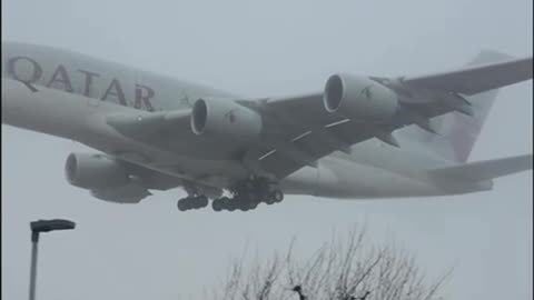 A Giant Qatar Airbus A380 Cuts Through The Fog Prior To Landing At London Heathrow Airport