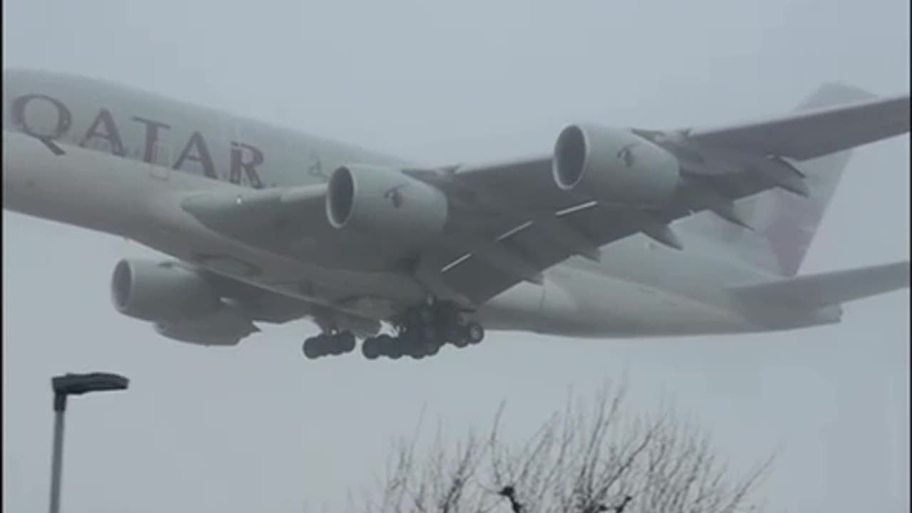 A Giant Qatar Airbus A380 Cuts Through The Fog Prior To Landing At London Heathrow Airport