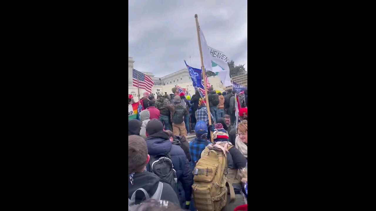 Protesters chanting "put the guns down"