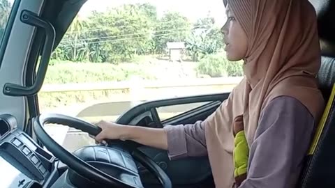 beautiful young truck driver full of skills