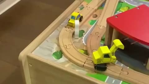 PLAYING WITH CARS AND TRAINS