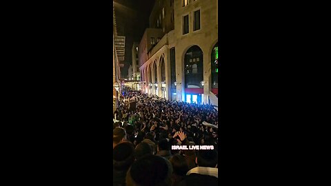 Hundreds of people celebrate the last night of Chanukah during a concert in Jerusalem's Mamila Mall