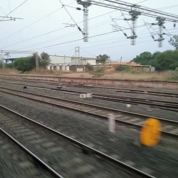 🚂🌾 Watching the train pass through the serene village area , #Travel_Diaries