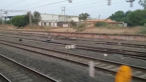 🚂🌾 Watching the train pass through the serene village area , #Travel_Diaries