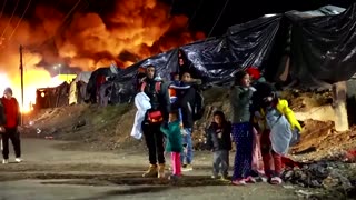 Migrants set fires during midnight camp raid in Mexico