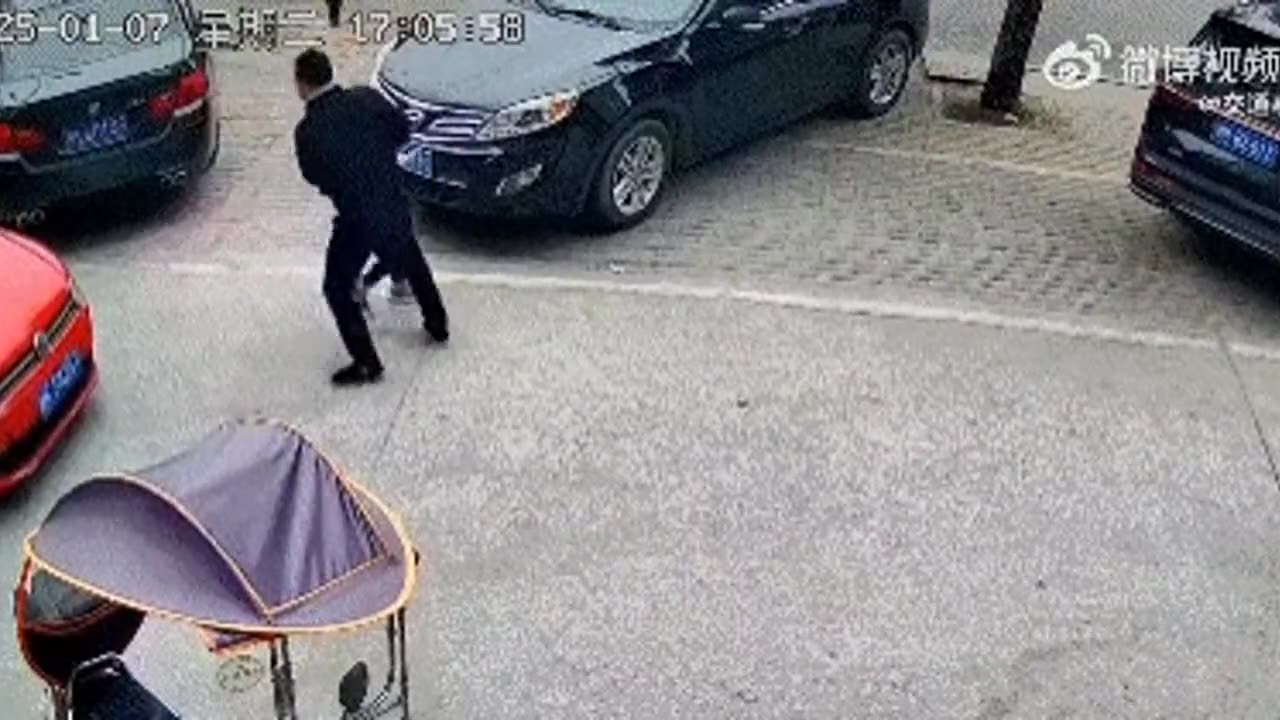 A man stopped a kid from running into the road.