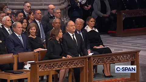 Kamala Harris glances back to observe the discussion between Obama and Trump.