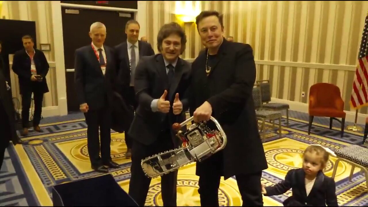 President of Argentina Javier Milei gifts Elon Musk a DOGE chainsaw.