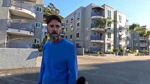 This man works where he overlooks a migrant hotel in San Diego, California