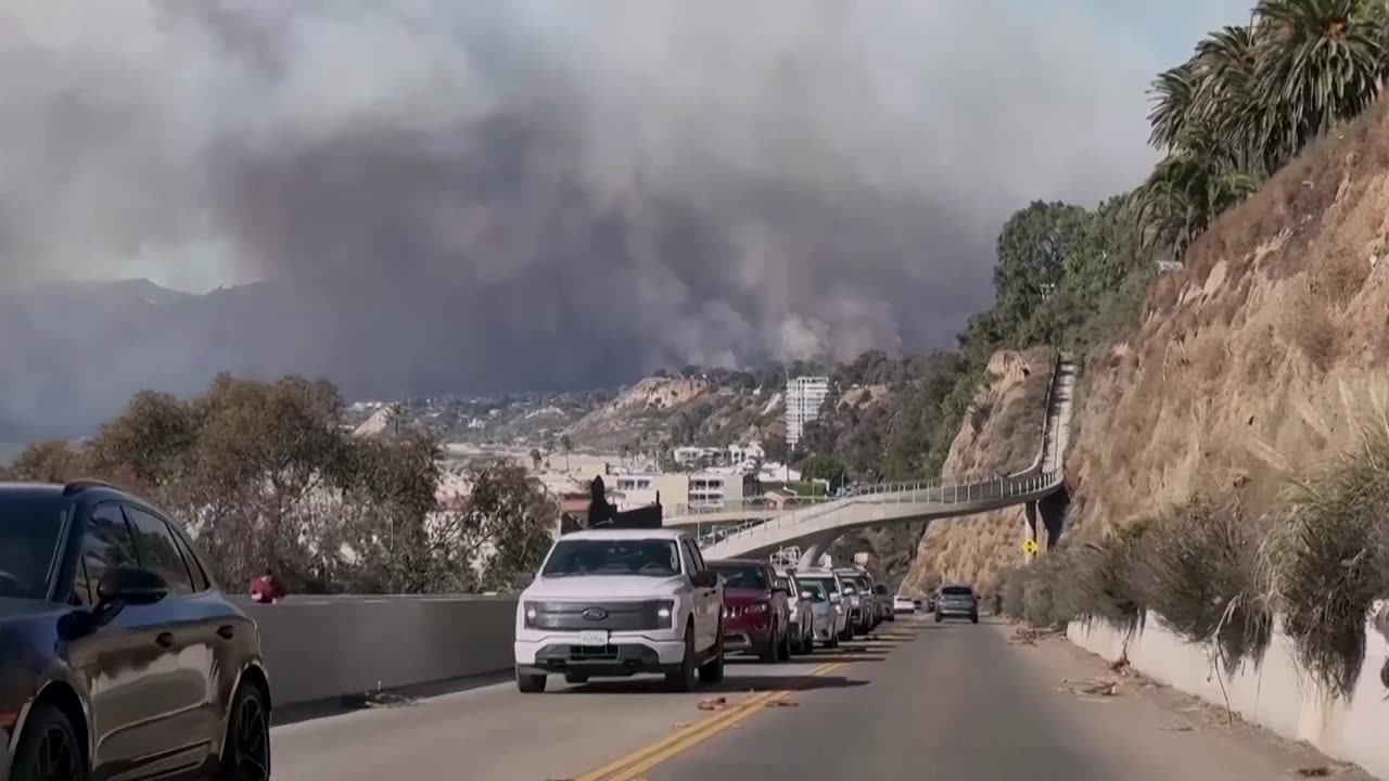 Wildfire rages in Los Angeles, forcing 30,000 to evacuate