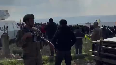 Hezbollah supporters hang their flag on a UN vehicle in southern Lebanon