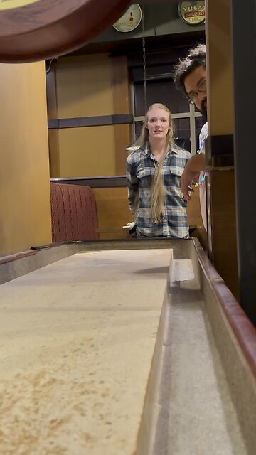 Enjoying a Game of Shuffleboard