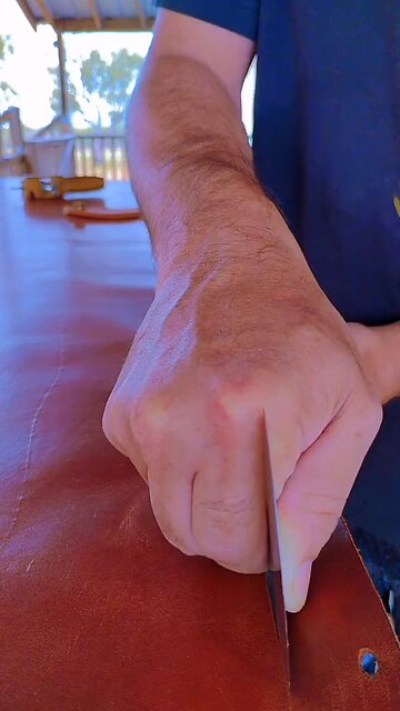 slicing up some leather