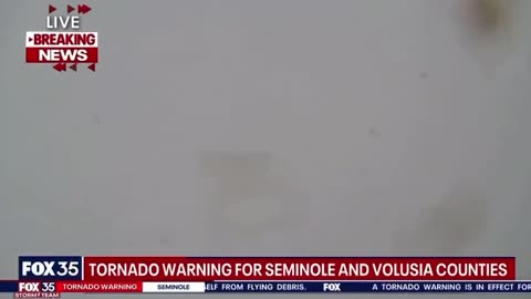 Tornado crossing I-4 in Florida swipes the Fox 35 studio LIVE on the air and