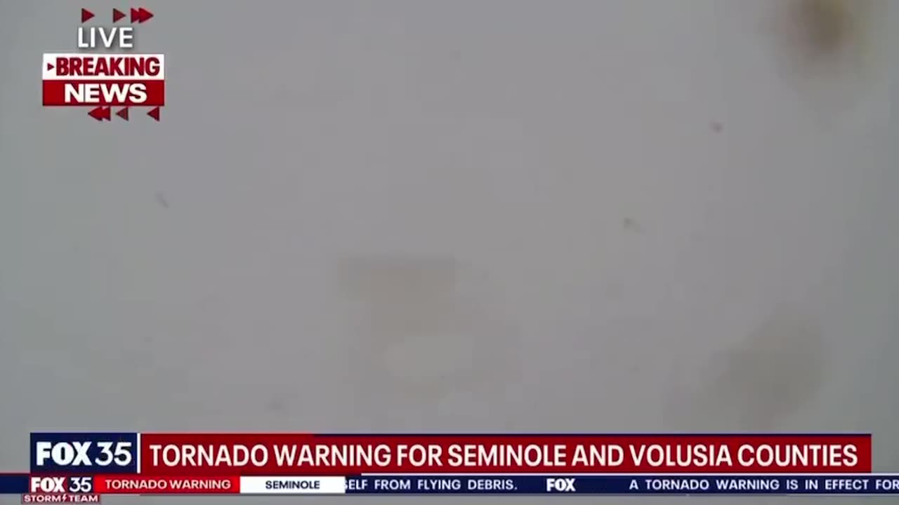 Tornado crossing I-4 in Florida swipes the Fox 35 studio LIVE on the air and
