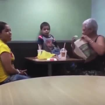 Gangsta Baby cusses and throws up gang signs