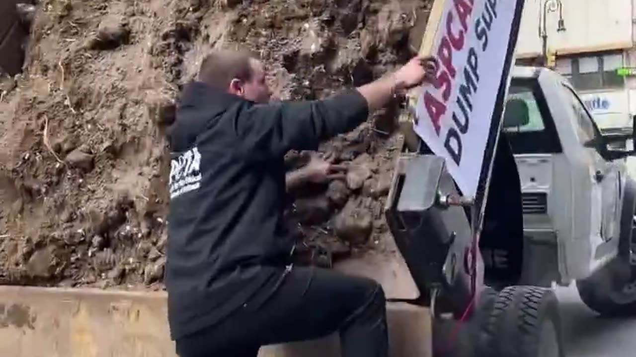 PETA activists attempted to dump a truckload of dirt in front of the ASPCA
