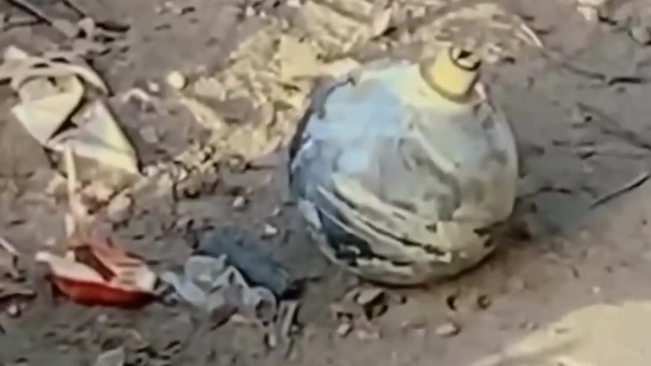 An unexploded drone bomb dropped near civilian homes was captured on video