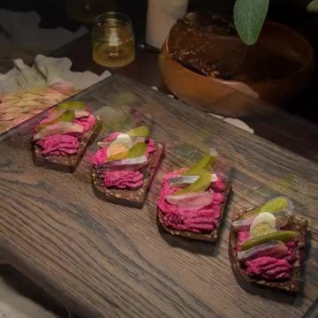 New Year's appetizer with black bread, herring and savory beetroot sauce