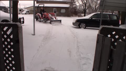 Trying my bad boy tractor in the snow, and starting the old Subaru