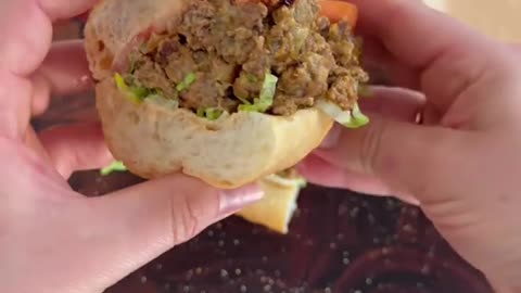 Chopped cheese on a grinder roll. onions and cheese.
