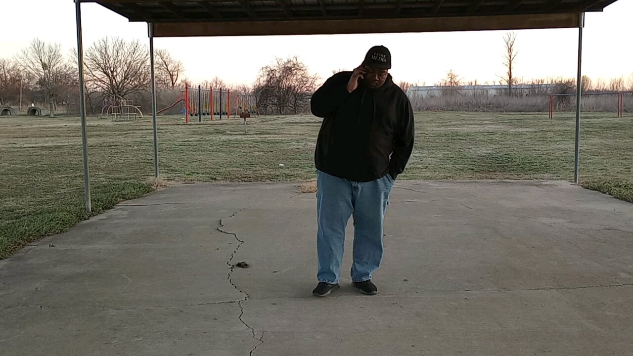 T-Style Isaac Kennedy talkin' with his partner Lil' Q at the park in West Helena, Arkansas.