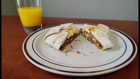 A steak, egg, hash brown with cheese wrap