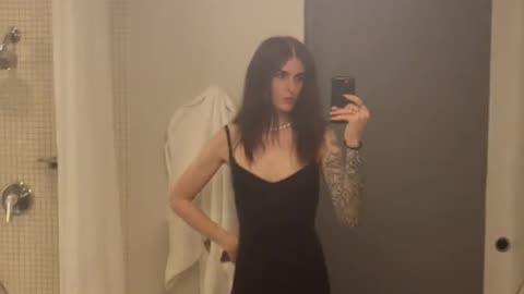 Tgirl seeing herself in the mirror