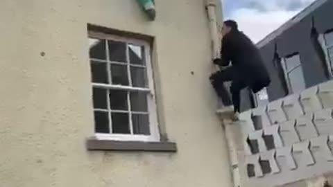 A patriotic British guy takes down the PLO flag rag.