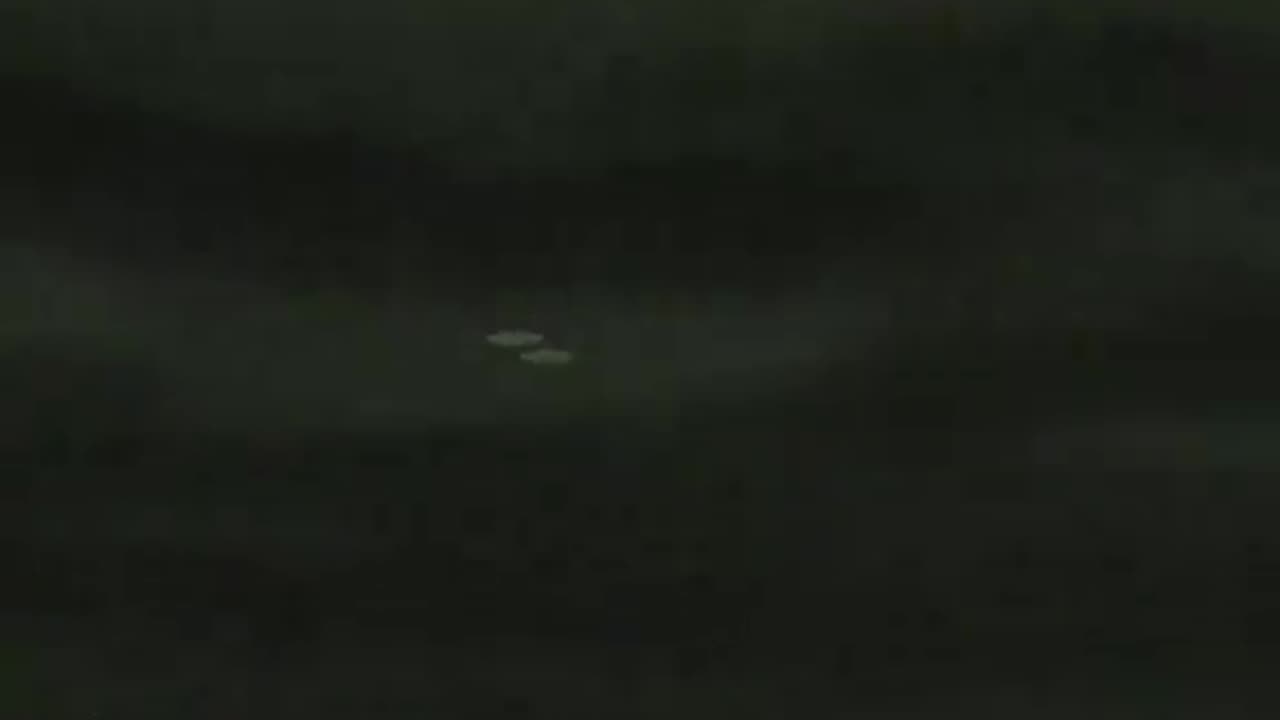 Alleged UFO Being Escorted