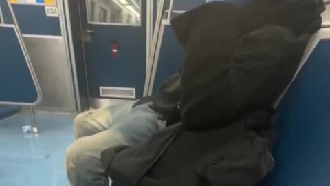 Nothing to see here! Just a migrant on a train holding two large knives!