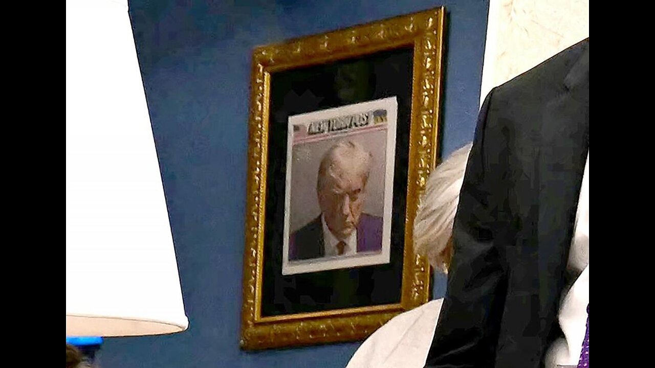 Trump hangs iconic mugshot outside the Oval Office