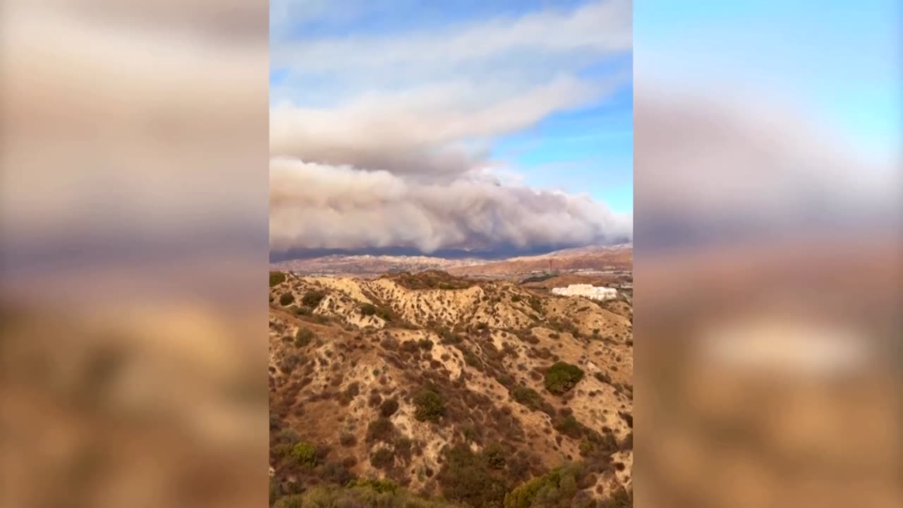 Sky turns orange over California highway from Hughes Fire