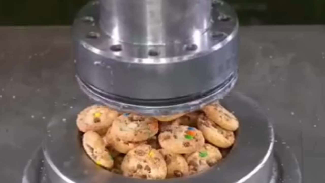 Hydraulic press crushing candies