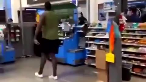 Big guy spewing trash gets knocked out cold at Walmart