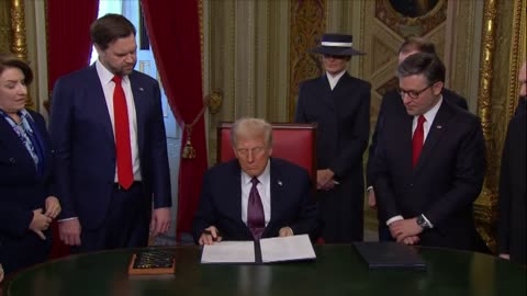 Donald Trump signs official papers in the President's Room on Inauguration Day