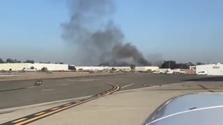 Smoke spotted as plane crashes into building in Fullerton, California