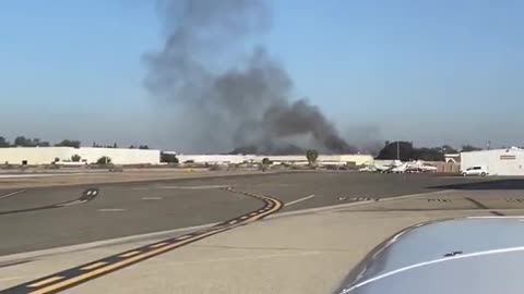 Smoke spotted as plane crashes into building in Fullerton, California